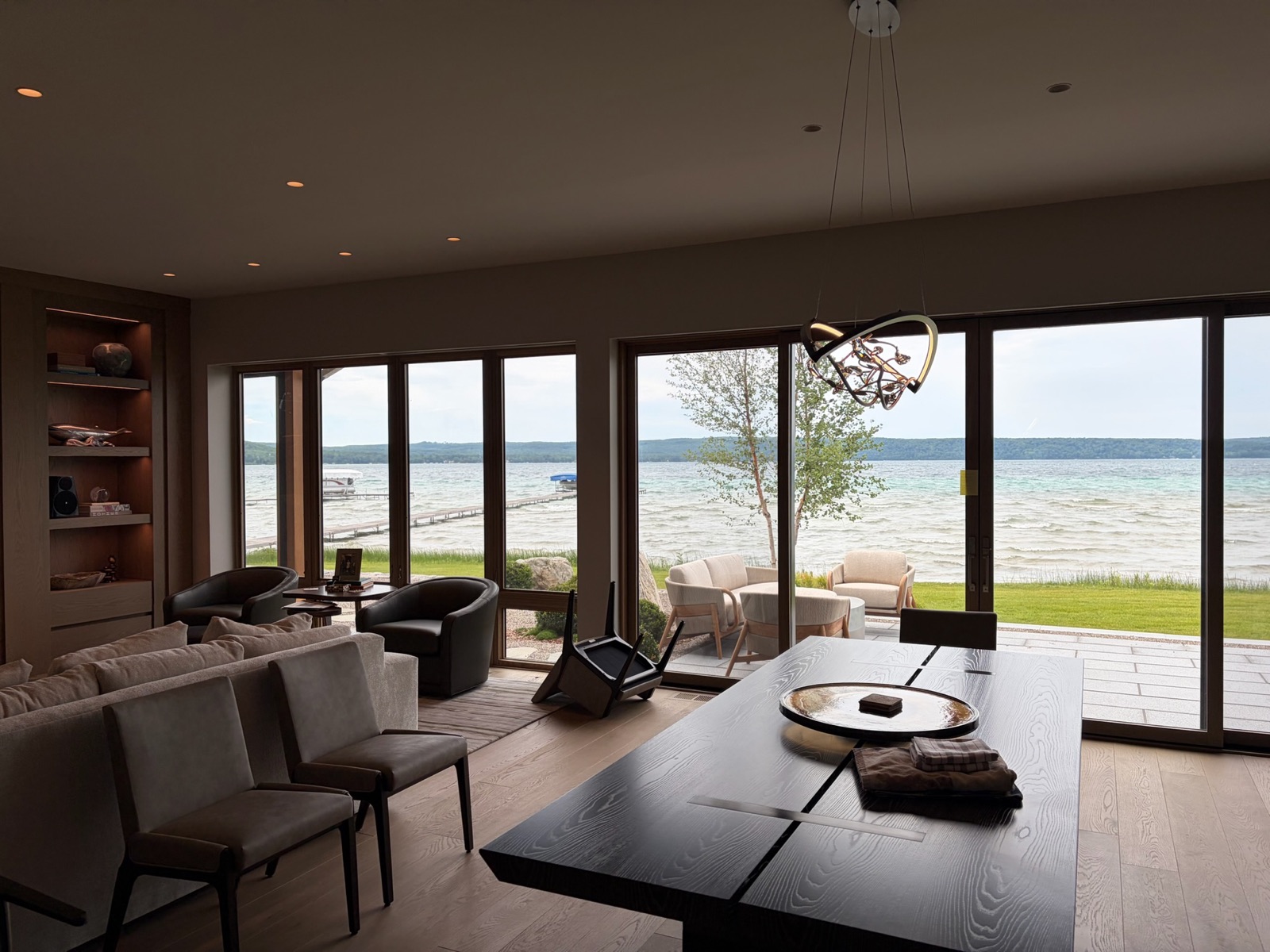 Lakefront great room with full-height glazing and freshly finished walls and ceiling
